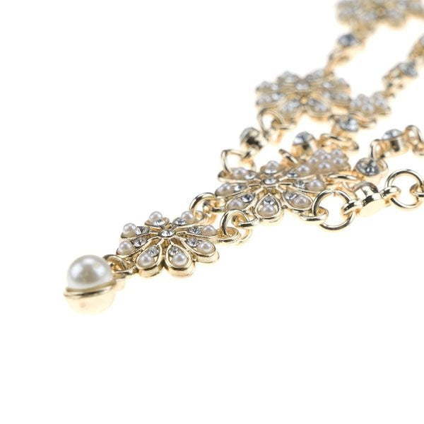 Haarketting goudkleurig strass crème bloemen